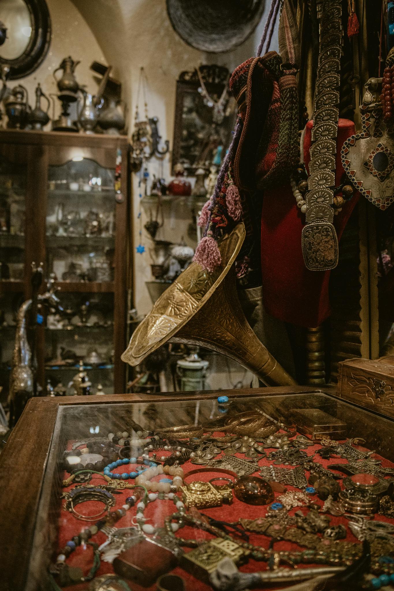 Explore an antique shop with vintage jewelry and collectibles beautifully displayed.