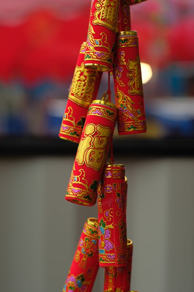 Bright and colorful hanging firecrackers symbolizing celebration and luck in a festival setting.